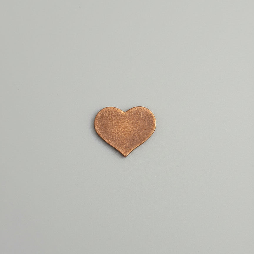 Heart-shaped object on a gray background